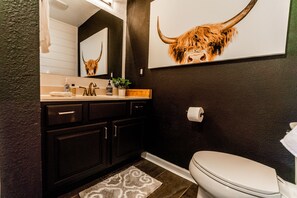 Bathtub, towels, soap, toilet paper