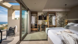 A modern hotel room with a balcony, a desk, and a bed. -  Grace Villas Collection (Hersonissos)