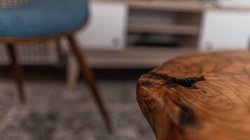 A close-up of a wooden table with a natural grain pattern.