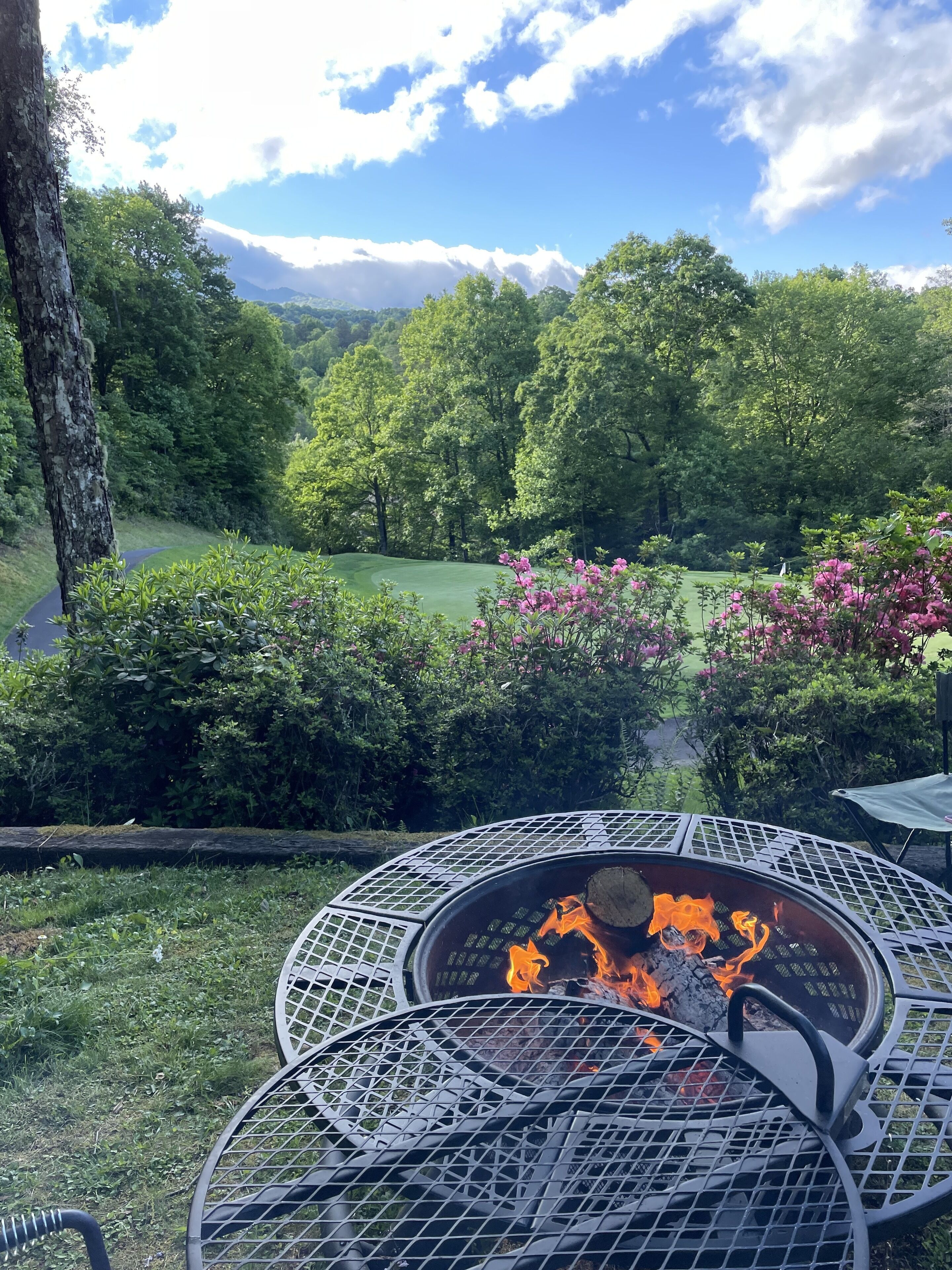 Fire pit with a view of mountains over the golf course (river under the trees)