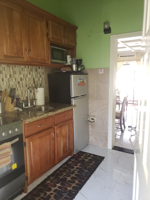 Microwave, coffee/tea maker, cookware/dishes/utensils