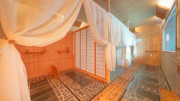 Experience traditional Japanese style in this serene room with tatami flooring, shoji screens, and a low ceiling.
