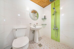 A bathroom with a toilet, sink, and shower. - Gapyeong Art Pension (Gapyeong)