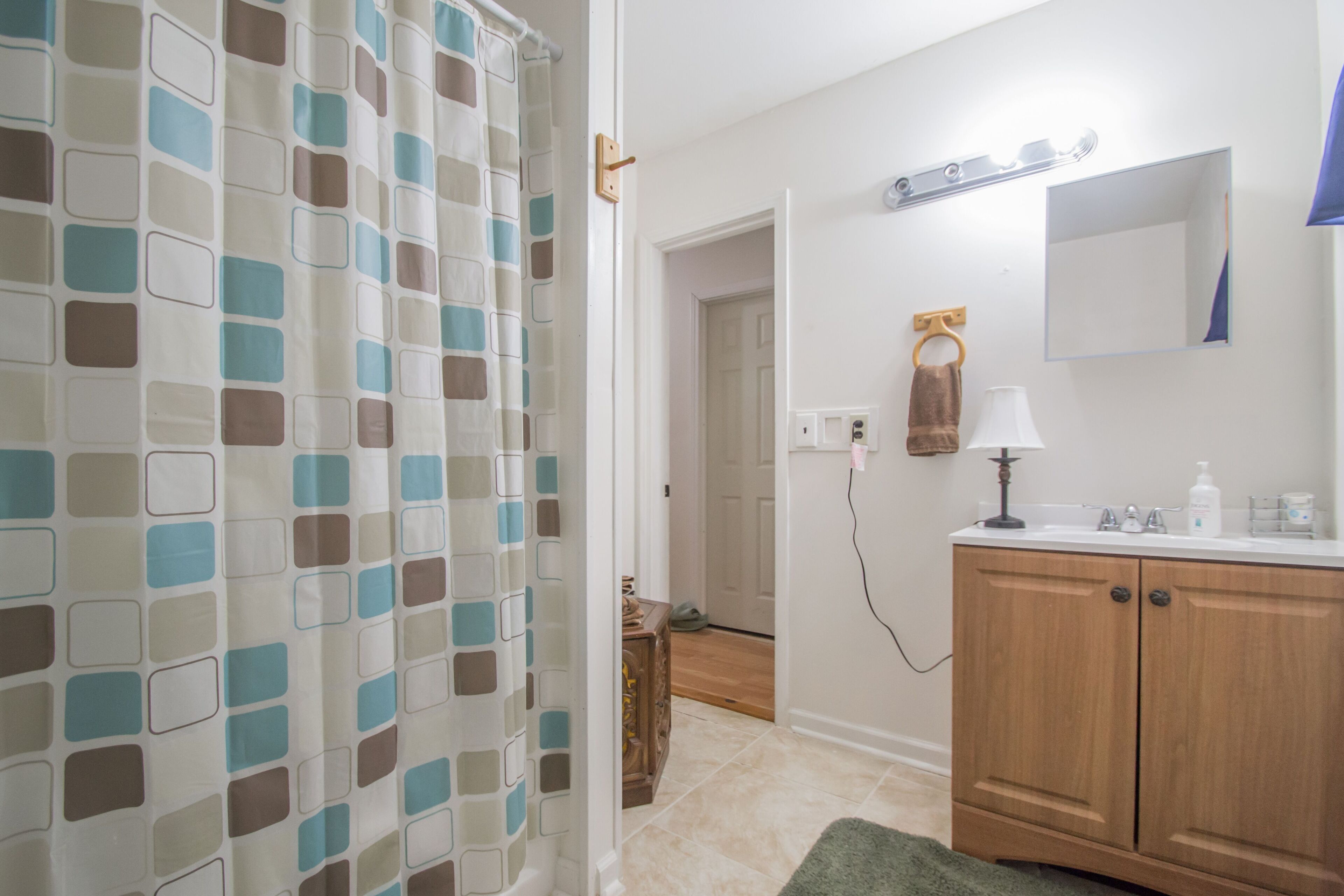 Combined shower/bathtub, towels, soap, toilet paper