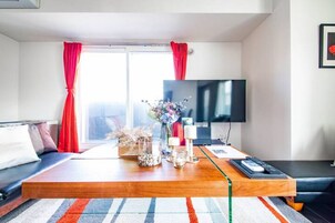 Apartment, Non Smoking | Living area | Flat-screen TV