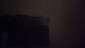 A dark room with a visible window and a door. - Blank Blank Blank Blank (Port Morant)