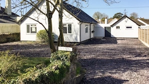 A white building with a sign reading "TY GORTH".