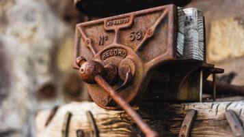A close-up of a rusted metal device with the inscription 'RECORD' and a dial marked '53'.