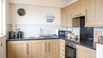 Fridge, electric kettle, toaster, cookware/dishes/utensils