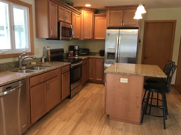 Microwave, dishwasher, coffee/tea maker, cookware/dishes/utensils