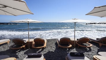 Private beach nearby, black sand, beach umbrellas, beach towels