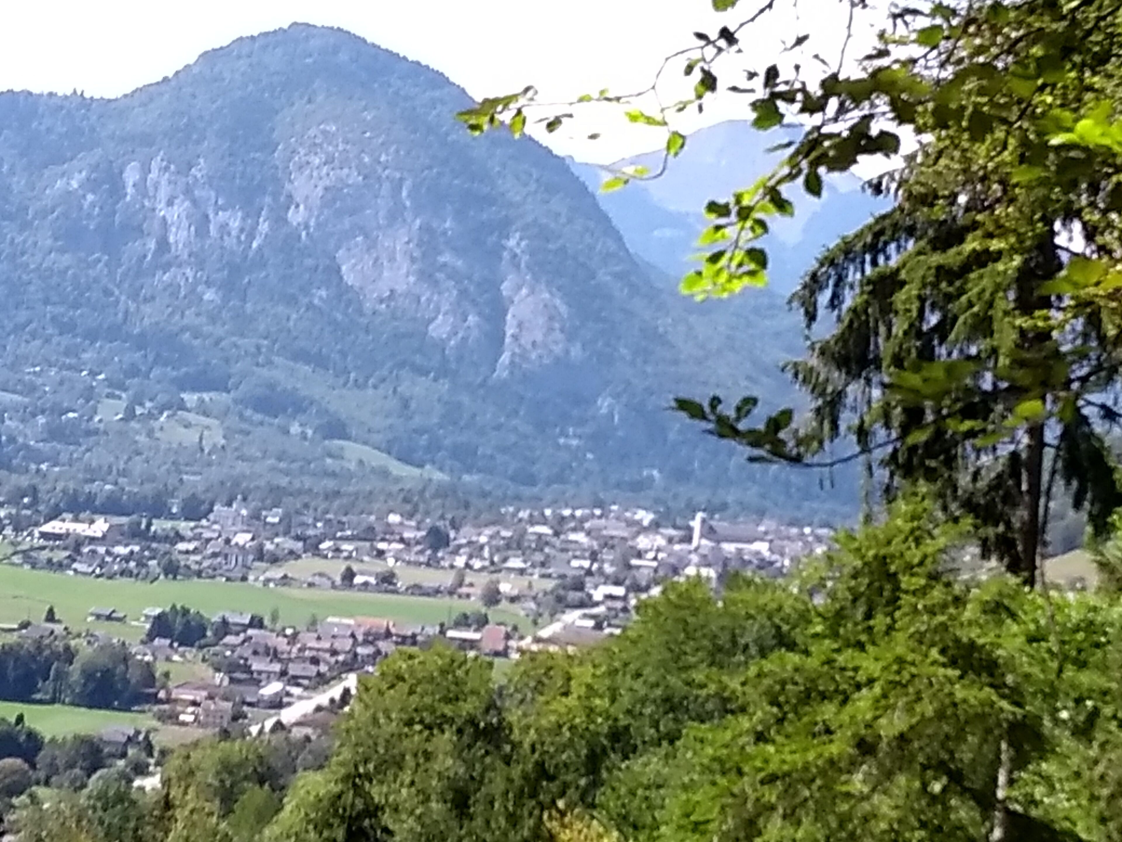 A mountainous landscape with a town in the valley.