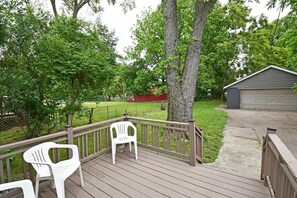 Enjoy the serene views from this deck with a comfortable seating area.
