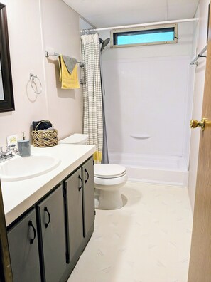 Shower, hair dryer, towels, soap