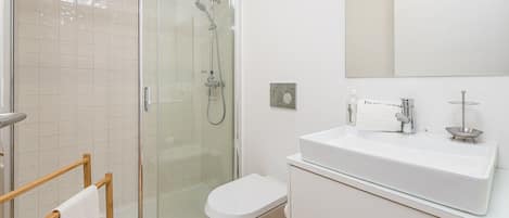 Shower, hair dryer, towels, soap
