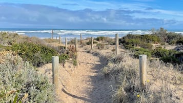 On the beach, sun-loungers, beach towels