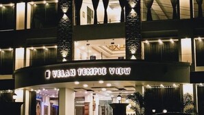 A multi-story building with a sign reading "VELAN TEMPLE VIEW". - Velan Temple View (Palani)