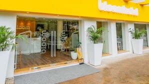 A modern building with a bright yellow facade and large windows. - Bloom Hotel - Worli (Mumbai)