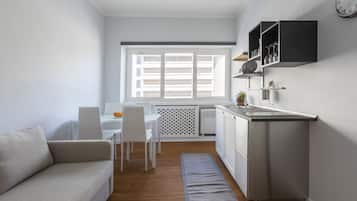 Deluxe Studio Suite | Living area | Flat-screen TV