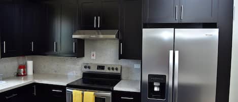Coffee/tea maker, fridge, microwave, oven