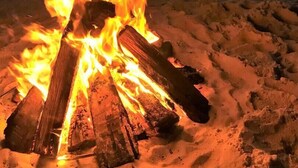 A campfire on a beach with a sunset in the background. - CABANA DEL SOL IS A 2BD/2BA GULF FRONT W/AMAZING VIEWS, 2 SCREEN PORCHES! (Port Saint Joe)