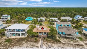 A coastal residential area with beachfront properties featuring balconies, some with outdoor seating. - CABANA DEL SOL IS A 2BD/2BA GULF FRONT W/AMAZING VIEWS, 2 SCREEN PORCHES! (Port Saint Joe)