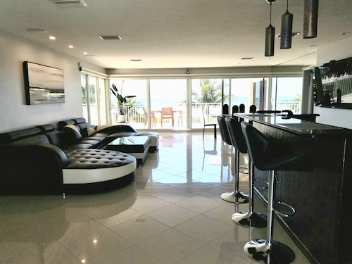 Beach front paradise located in a Condo Building Beach front Penthouse!