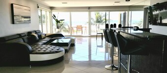 Beach front paradise located in a Condo Building Beach front Penthouse!