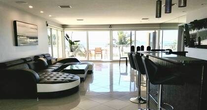 Beach front paradise located in a Condo Building Beach front Penthouse!