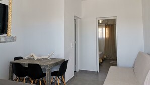Deluxe Apartment | Living area - Big place for group 12 (Santorini)