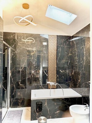 Bathtub, hair dryer, towels, soap