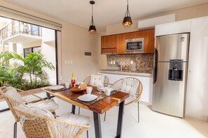 Fridge, microwave, stovetop, coffee/tea maker