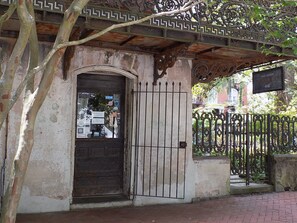 Traditional building with a secure entrance and ornate metalwork.