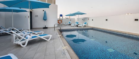 Outdoor pool, open 7:00 AM to 6:00 PM, sun loungers