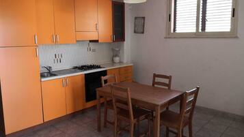 Fridge, stovetop, cookware/dishes/utensils, dining tables