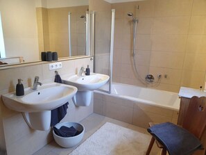Combined shower/tub, hair dryer, towels, soap