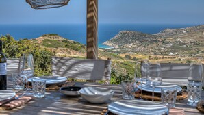 A table set for dining with a view of the sea and hills. - La Bergerie Dantiparos (Antiparos)