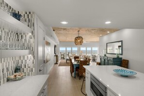 Enjoy meals in the kitchen with an oven and sink, and dine at the large table with ocean views.