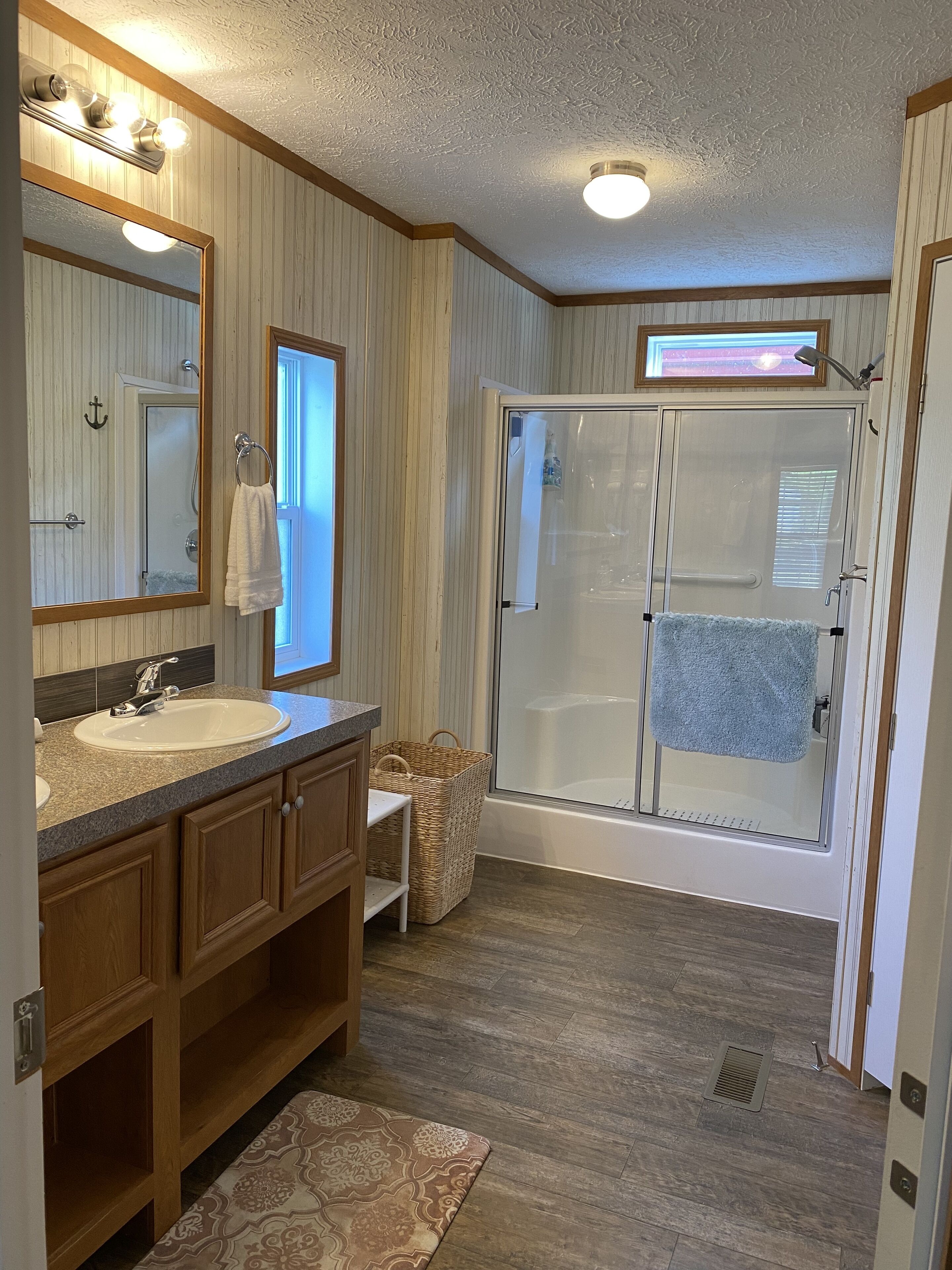 Combined shower/tub, hair dryer, towels, soap