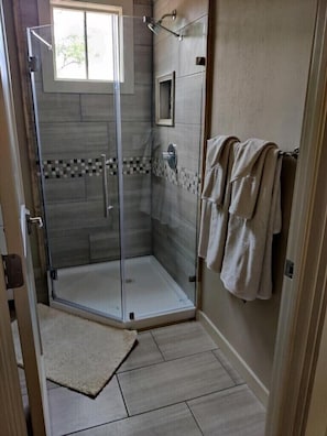Shower, towels, soap, toilet paper