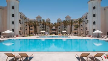 Outdoor pool, open 7:00 AM to 5:00 PM, pool umbrellas, sun loungers