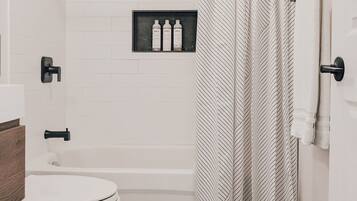 Combined shower/bathtub, hair dryer, towels, soap