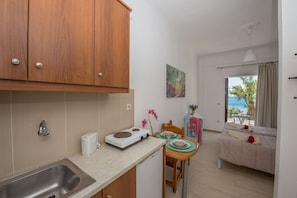 Fridge, stovetop, electric kettle, toaster