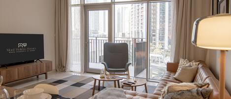 Deluxe Apartment | Living area | 55-inch LCD TV with satellite channels, TV