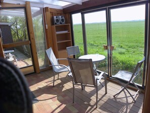 Dining - Large garden with playground, patio, garden shed, close to the village, individual, 3 living units. (Wangerland)