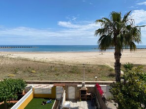 On the beach, sun-loungers, beach towels