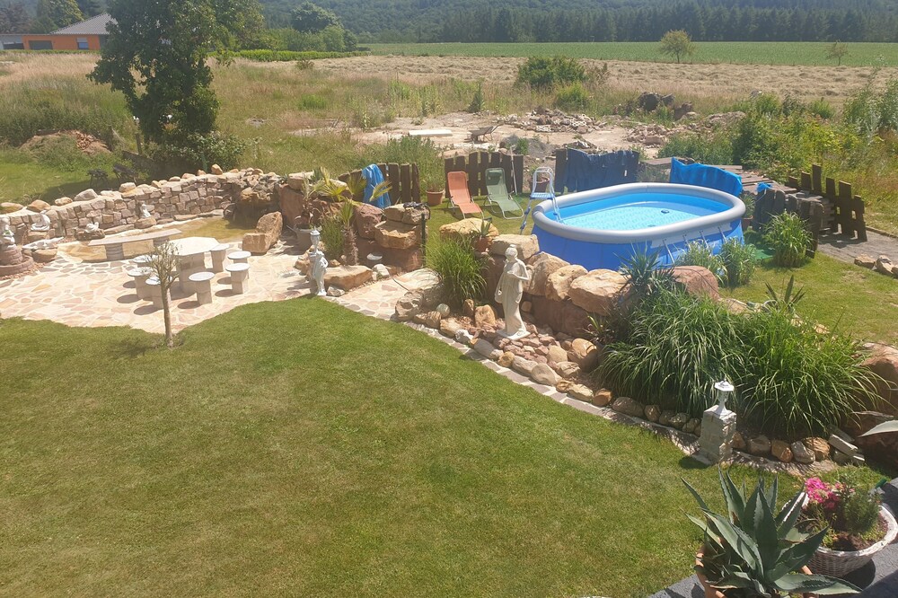Holiday house "Palmland" with whirlpool, small waterfall and water place