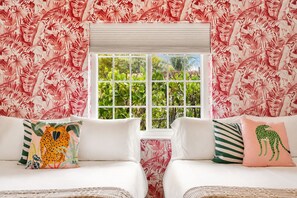 A room with a window, two white beds, and tropical leaf-patterned wallpaper. - Saltwater Pool, Fire Pit | Gated Brickell Oasis (Miami)