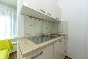 Fridge, microwave, stovetop, cookware/dishes/utensils