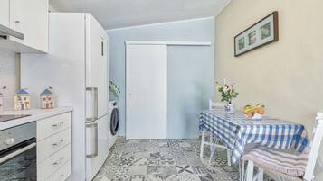 Fridge, electric kettle, cookware/dishes/utensils